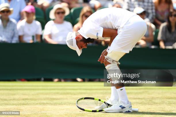 Benoit Paire of France reacts against Juan Martin del Potro of Argentina during their Men's Singles third round match on day six of the Wimbledon...