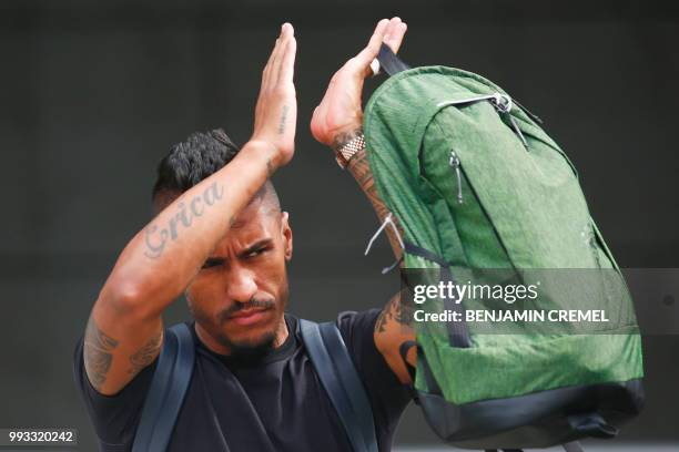 Brazil's midfielder Paulinho leaves his team's hotel in Kazan on July 7 a day after the five-time champions crashed out of the Russia 2018 World Cup...