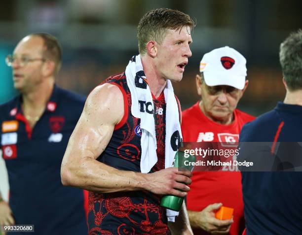 Sam Frost of the Demons tries to cool down during the round 16 AFL match between the Melbourne Demons and the Fremantle Dockers at TIO Stadium on...