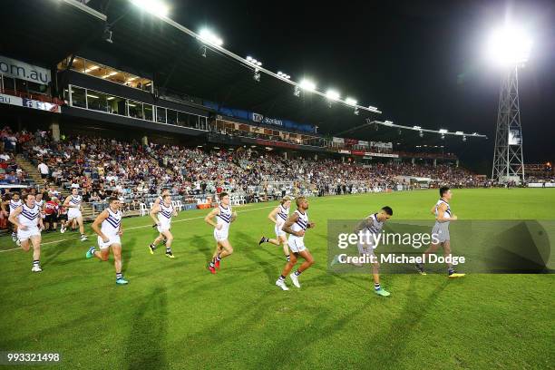 General view is seen as Dockers players run out during the round 16 AFL match between the Melbourne Demons and the Fremantle Dockers at TIO Stadium...
