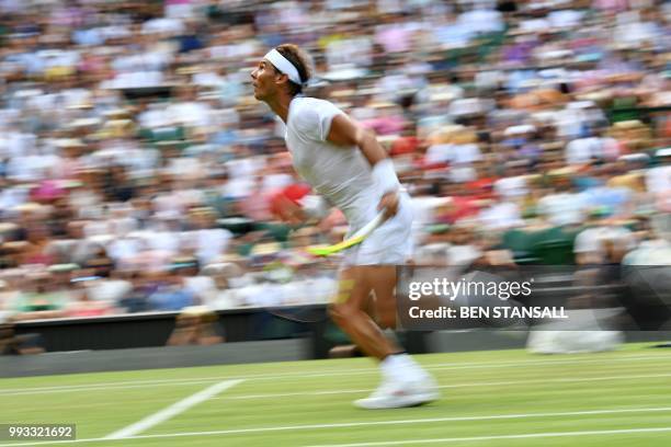 Spain's Rafael Nadal to play a shot against Australia's Alex De Minaur during their men's singles third round match on the sixth day of the 2018...