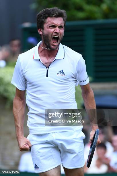 Gilles Simon of France celebrates winning match point against Matthew Ebden of Australia during their Men's Singles third round match on day six of...