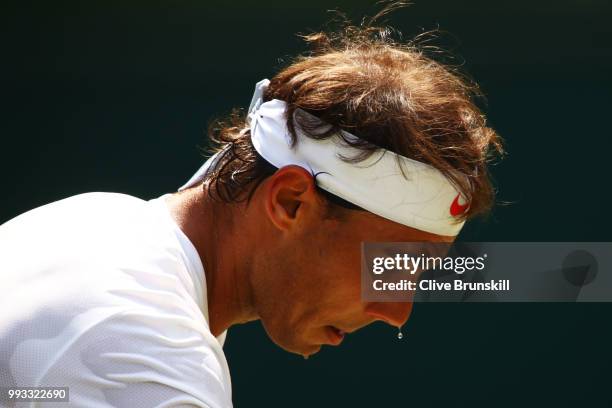 Rafael Nadal of Spain in action against Alex De Minaur of Australia during their Men's Singles third round match on day six of the Wimbledon Lawn...