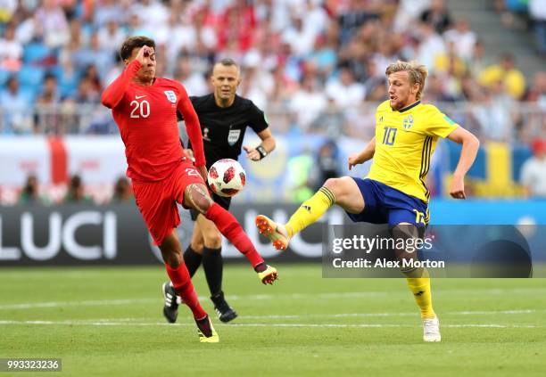 Emil Forsberg of Sweden challenge for the ball with Dele Alli of England during the 2018 FIFA World Cup Russia Quarter Final match between Sweden and...