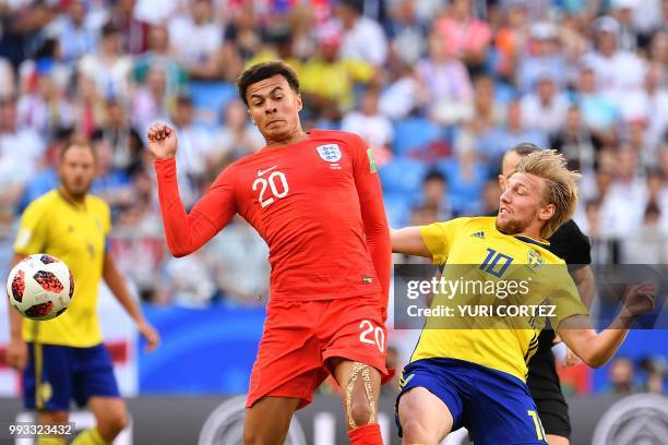 Sweden's midfielder Emil Forsberg vies with England's midfielder Dele Alli during the Russia 2018 World Cup quarter-final football match between...