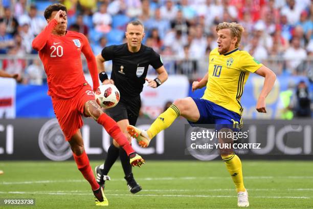 Sweden's midfielder Emil Forsberg vies with England's midfielder Dele Alli during the Russia 2018 World Cup quarter-final football match between...