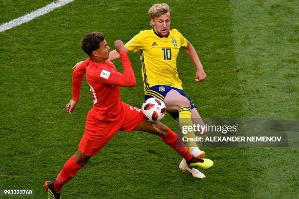 England's midfielder Dele Alli vies for the ball with Sweden's midfielder Emil Forsberg during the Russia 2018 World Cup quarter-final football match...