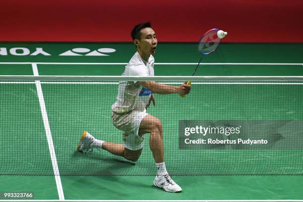 Lee Chong Wei of Malaysia competes against Kento Momota of Japan during the Men's Singles Semi-final match on day five of the Blibli Indonesia Open...