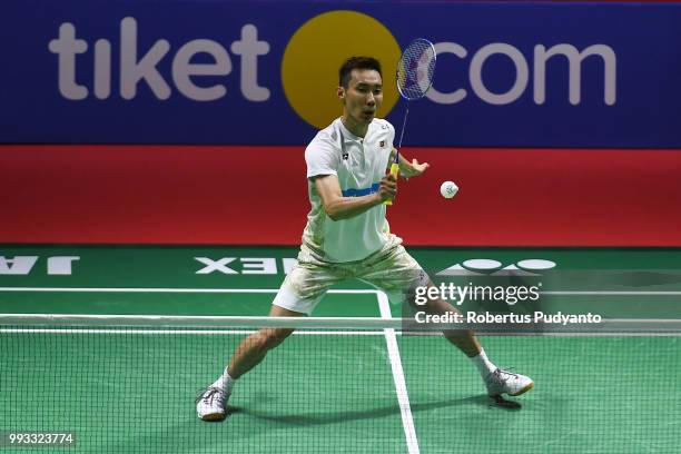 Lee Chong Wei of Malaysia competes against Kento Momota of Japan during the Men's Singles Semi-final match on day five of the Blibli Indonesia Open...