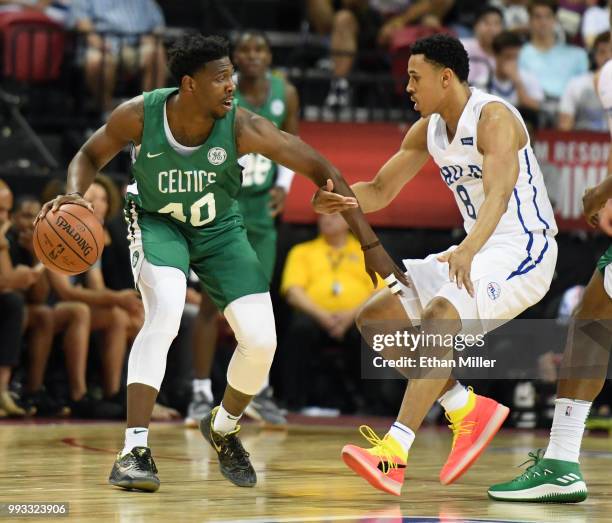 Justin Bibbs of the Boston Celtics is guarded by Zhaire Smith of the Philadelphia 76ers during the 2018 NBA Summer League at the Thomas & Mack Center...