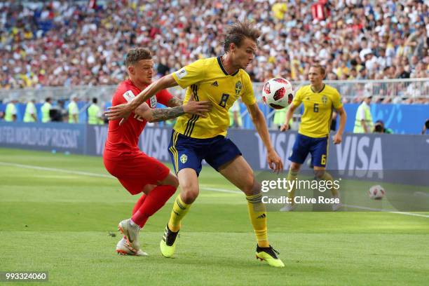 Albin Ekdal of Sweden is challenged by Kieran Trippier of England during the 2018 FIFA World Cup Russia Quarter Final match between Sweden and...