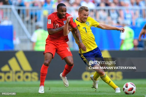 Sweden's midfielder Sebastian Larsson marks England's forward Raheem Sterling during the Russia 2018 World Cup quarter-final football match between...
