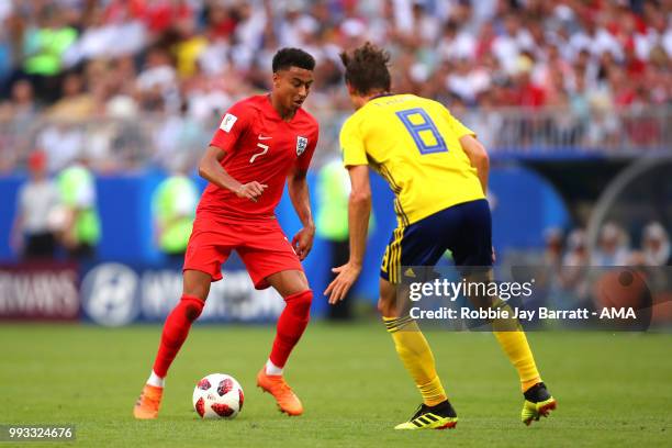 Jesse Lingard of England competes with Albin Ekdal of Sweden during the 2018 FIFA World Cup Russia Quarter Final match between Sweden and England at...