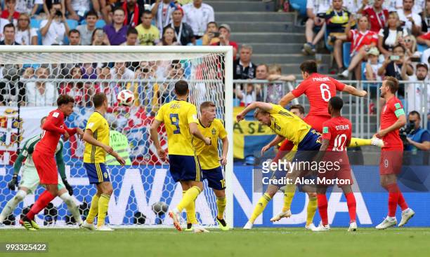 Harry Maguire of England scores his team's first goal during the 2018 FIFA World Cup Russia Quarter Final match between Sweden and England at Samara...
