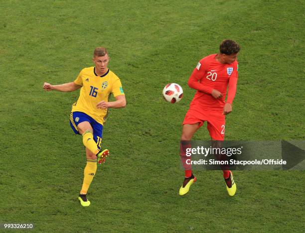 Emil Krafth of Sweden clears the ball from the flinching Dele Alli of England during the 2018 FIFA World Cup Russia Quarter Final match between...