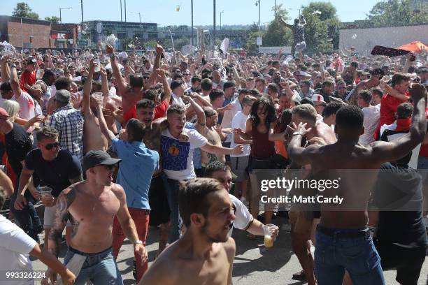 England fans celebrate England's first goal as they take on Sweden in the World Cup quarter finals at Ashton Gate World Cup fans village at the...