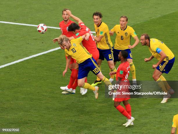 Emil Forsberg of Sweden is beaten to the ball by Harry Maguire of England who heads the opening goal during the 2018 FIFA World Cup Russia Quarter...