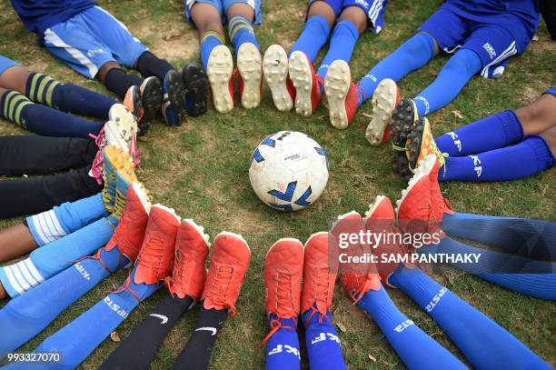 Gujarati school children pose for a picture before their practice for the forthcoming Gothia Cup to be held in Gothenburg in Sweden, on the outskirts...