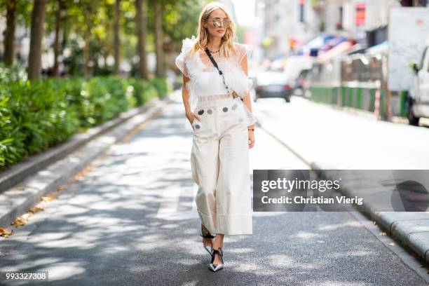 Leonie Sophie Hanne wearing white sheer ruffled top, cropped wide leg pants is seen outside Viktor & Rolf on day four during Paris Fashion Week Haute...