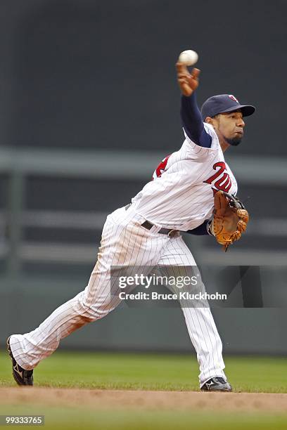 Alexi Casilla of the Minnesota Twins fields a ball hit by the Chicago White Sox on May 12, 2010 at Target Field in Minneapolis, Minnesota. The Twins...