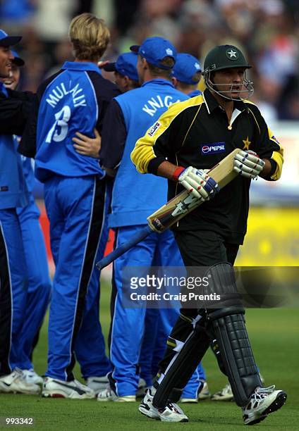 Shahid Afridi of Pakistan walks off after being caught by Mark Ealham of England off the bowling of Alan Mullally during the Natwest one day series...
