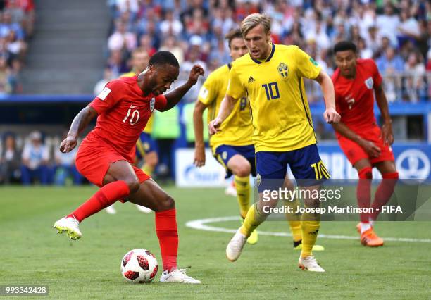 Raheem Sterling of England is challenged by Emil Forsberg of Sweden during the 2018 FIFA World Cup Russia Quarter Final match between Sweden and...