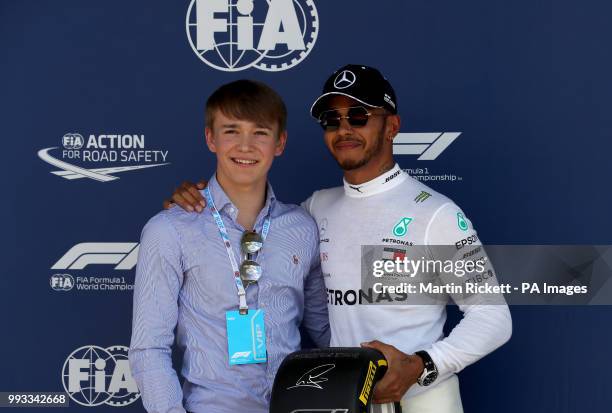 Mercede's Lewis Hamitlon poses with British Racing driver Billy Monger after qualifying for the 2018 British Grand Prix at Silverstone Circuit,...