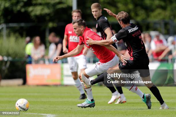 Mats Seuntjens of AZ Alkmaar, Jakob Poulsen of FC Midtjylland during the Club Friendly match between AZ Alkmaar v FC Midtjylland at the VV Dirkshorn...