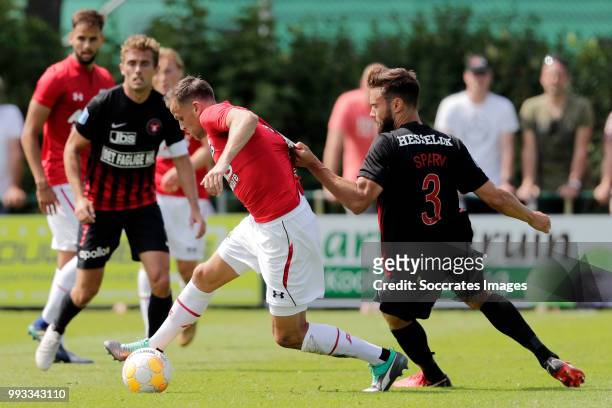 Mats Seuntjens of AZ Alkmaar, Tim Sparv of FC Midtjylland during the Club Friendly match between AZ Alkmaar v FC Midtjylland at the VV Dirkshorn on...