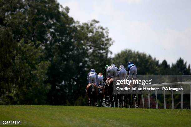 Runners take an early bend during The Coral Marathon Race run during Coral Eclipse day at Sandown Park Racecourse, Esher.