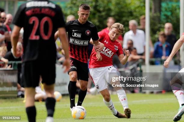 Kian Hansen of FC Midtjylland, Jonas Svensson of AZ Alkmaar during the Club Friendly match between AZ Alkmaar v FC Midtjylland at the VV Dirkshorn on...