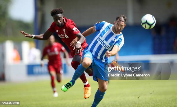 Divock Origi of Liverpool and Jon Moran of Chester FC during the Pre-season friendly between Chester FC and Liverpool on July 7, 2018 in Chester,...