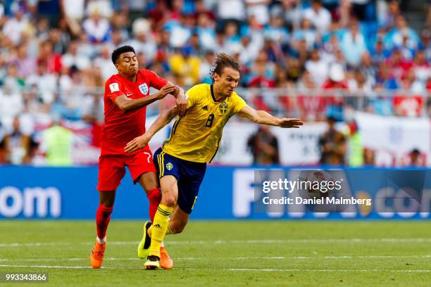 Jesse Lingard of England and Albin Ekdal of Sweden battle for the ball during the 2018 FIFA World Cup Russia Quarter Final match between Sweden and...