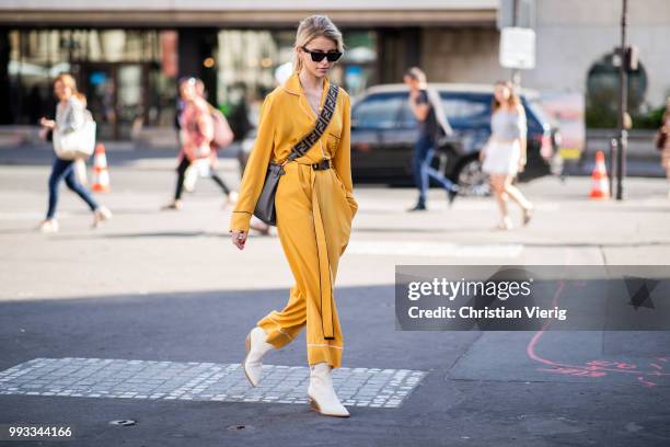 Caroline Daur wearing yellow overall, Fendi bag is seen outside Fendi Couture on day four during Paris Fashion Week Haute Couture FW18 on July 4,...