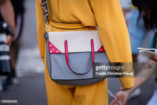 Caroline Daur wearing yellow overall, Fendi bag is seen outside Fendi Couture on day four during Paris Fashion Week Haute Couture FW18 on July 4,...