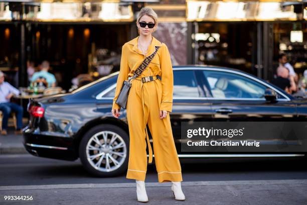 Caroline Daur wearing yellow overall, Fendi bag is seen outside Fendi Couture on day four during Paris Fashion Week Haute Couture FW18 on July 4,...