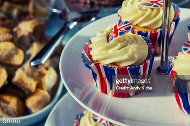 cupcakes with the union jack on a cake stand. - british flag cake stock pictures, royalty-free photos & images