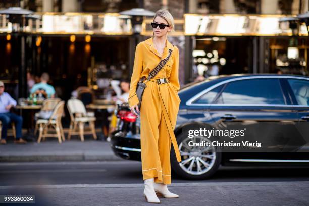 Caroline Daur wearing yellow overall, Fendi bag is seen outside Fendi Couture on day four during Paris Fashion Week Haute Couture FW18 on July 4,...