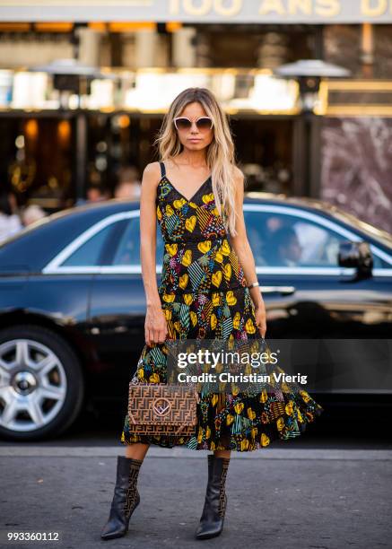 Erica Pelosini wearing Fendi bag, boots and dress with print seen outside Fendi Couture on day four during Paris Fashion Week Haute Couture FW18 on...