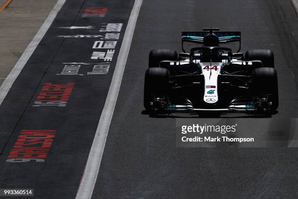 Lewis Hamilton of Great Britain driving the Mercedes AMG Petronas F1 Team Mercedes WO9 in the Pitlane during qualifying for the Formula One Grand...