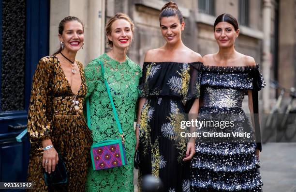 Margherita Maccapani Missoni, Elizabeth von Thurn und Taxis, Bianca Brandolini and Giovanna Battaglia wearing off shoulder dress seen outside...