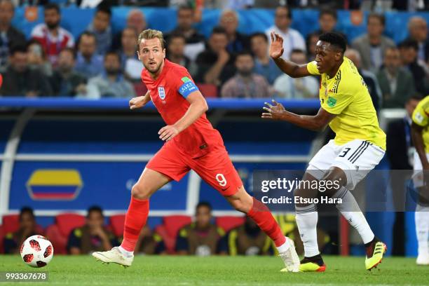 Harry Kane of England and Yerry Mina of Colombia compete for the ball during the 2018 FIFA World Cup Russia Round of 16 match between Colombia and...