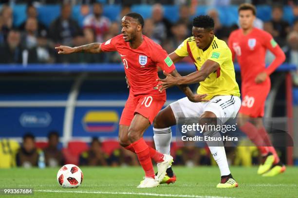 Raheem Sterling of England and Yerry Mina of Colombia compete for the ball during the 2018 FIFA World Cup Russia Round of 16 match between Colombia...