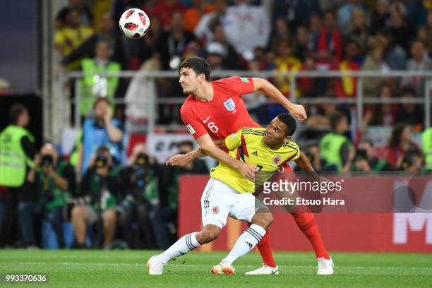 Harry Maguire of England and Carlos Bacca of Colombia compete for the ball during the 2018 FIFA World Cup Russia Round of 16 match between Colombia...