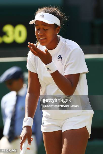 Naomi Osaka of Japan reacts during her Ladies' Singles third round match against Angelique Kerber of Germany on day six of the Wimbledon Lawn Tennis...