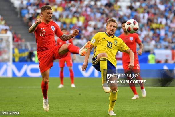 England's defender Kieran Trippier vies with Sweden's midfielder Emil Forsberg during the Russia 2018 World Cup quarter-final football match between...