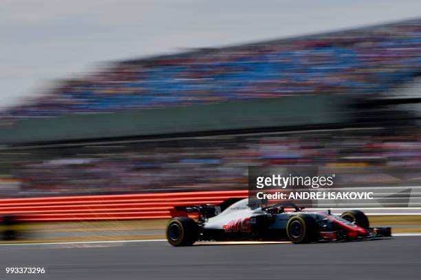 Haas F1's Danish driver Kevin Magnussen drives during the qualifying session at Silverstone motor racing circuit in Silverstone, central England, on...