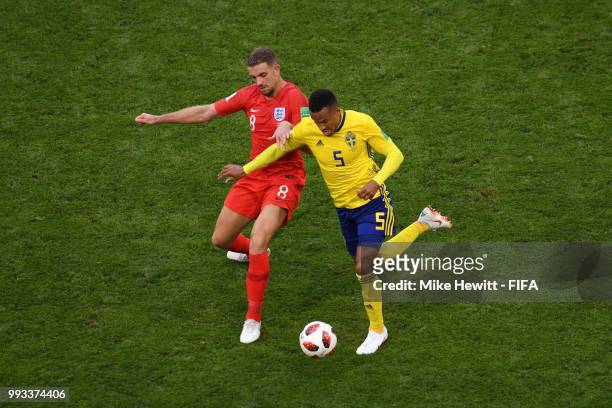Jordan Henderson of England battles for possession with Martin Olsson of Sweden during the 2018 FIFA World Cup Russia Quarter Final match between...