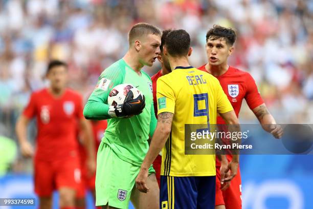 Jordan Pickford of England confronts Marcus Berg of Sweden during the 2018 FIFA World Cup Russia Quarter Final match between Sweden and England at...