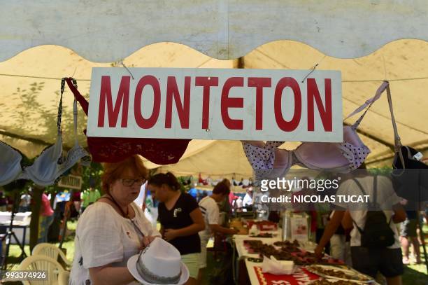 People attend the annual meeting of French towns and villages with odd-sounding names on July 7, 2018 in Monteton, southwestern France.